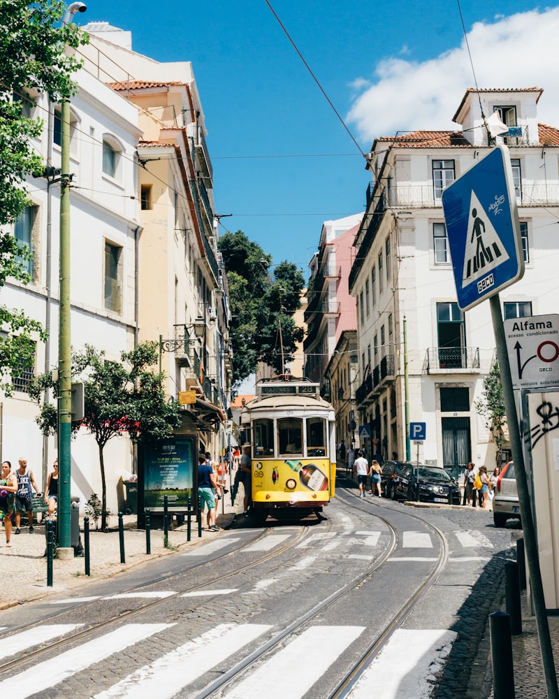 Traditional yellow tram in Lisbon streets